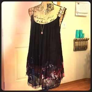 Free People beautiful Embroidered lined tank top.
